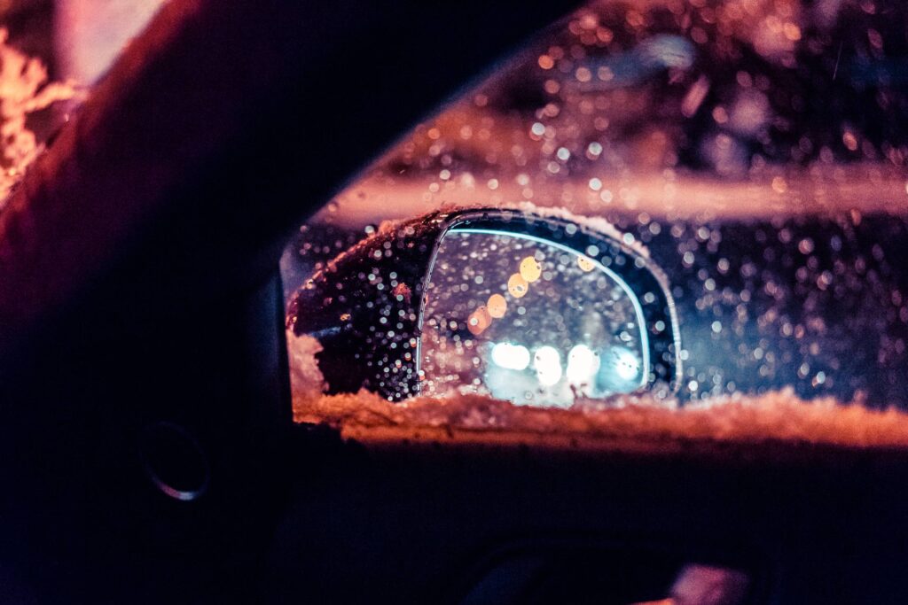 Car Rear-View Side Mirror in Snowy Weather Free Photo