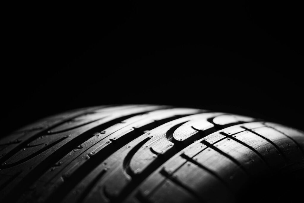 Car tire on a Black Background Free Photo