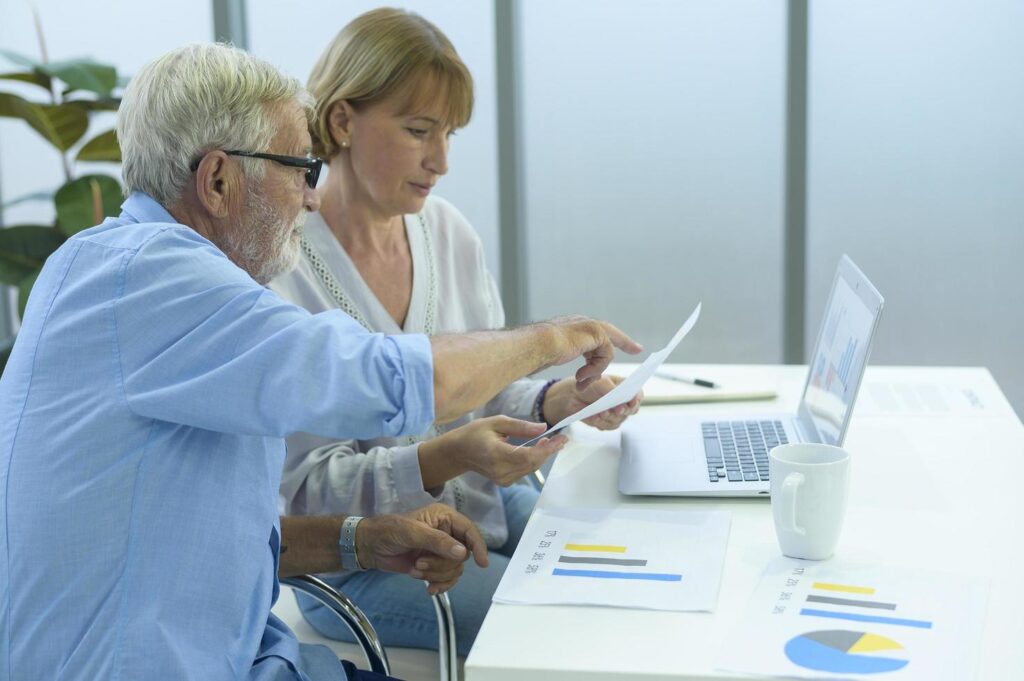 Caucasian senior Business people working and brainstorming in modern office Stock Free