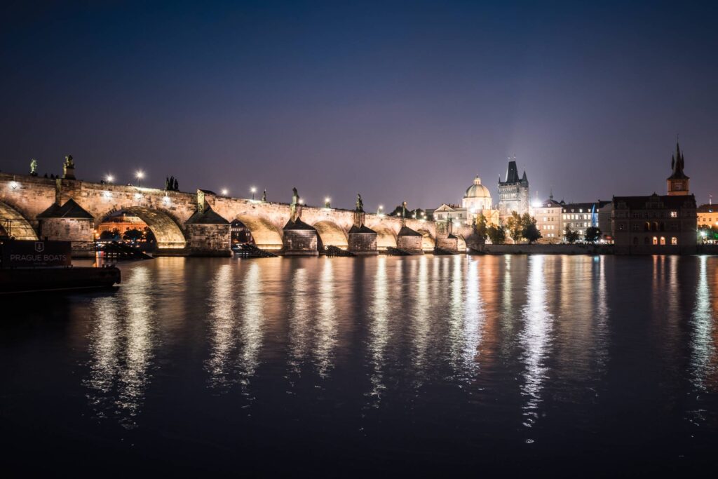 Charles Bridge and Vltava River in Prague at Night Free Photo