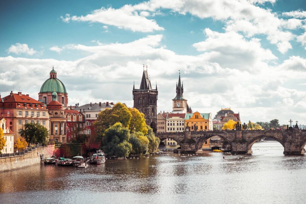 Charles Bridge and Vltava River in Sunny Prague Free Photo