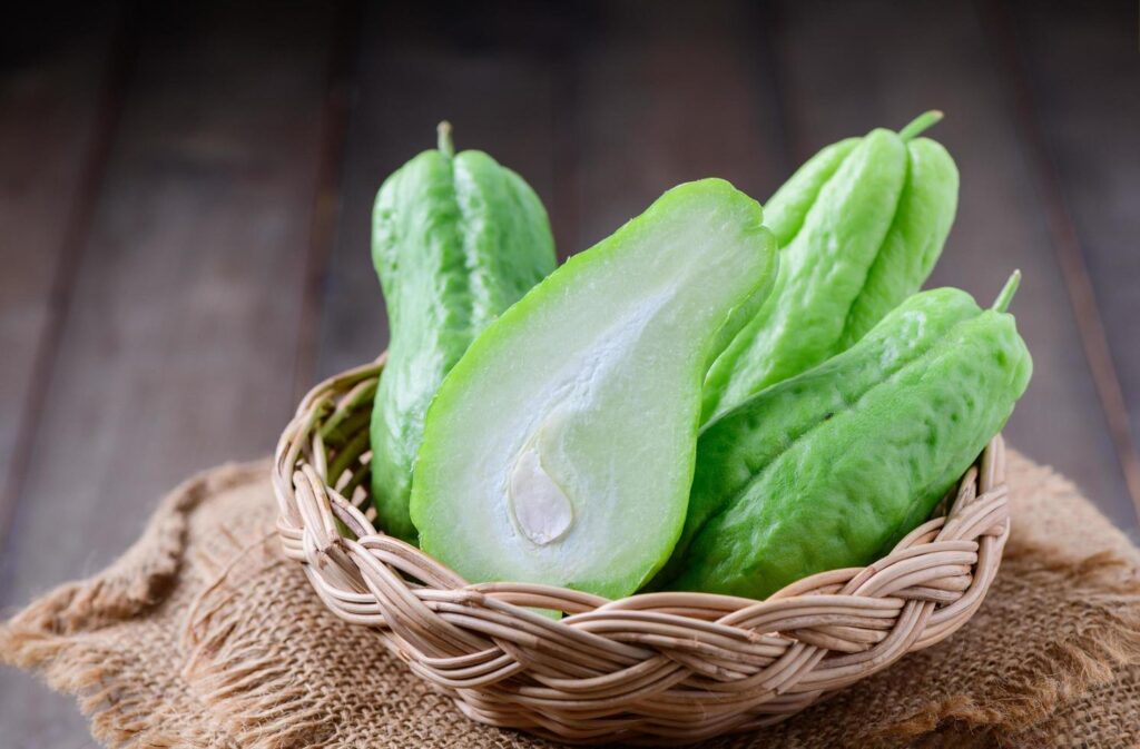 chayote fruit on bamboo basket, Healthy food concept Stock Free