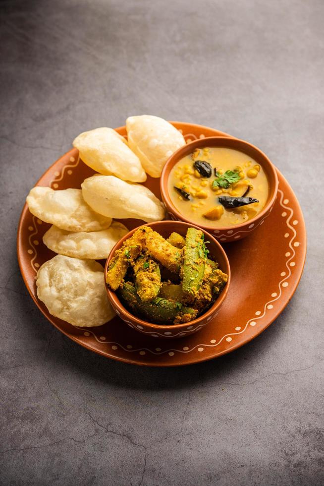 Cholar dal and patol aloo sabzi served with fried Luchi or poori, bengali food Stock Free