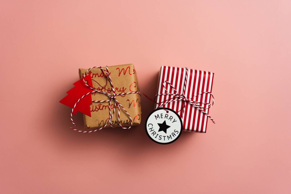 Christmas Gifts Flat Lay on Pink Background Free Photo