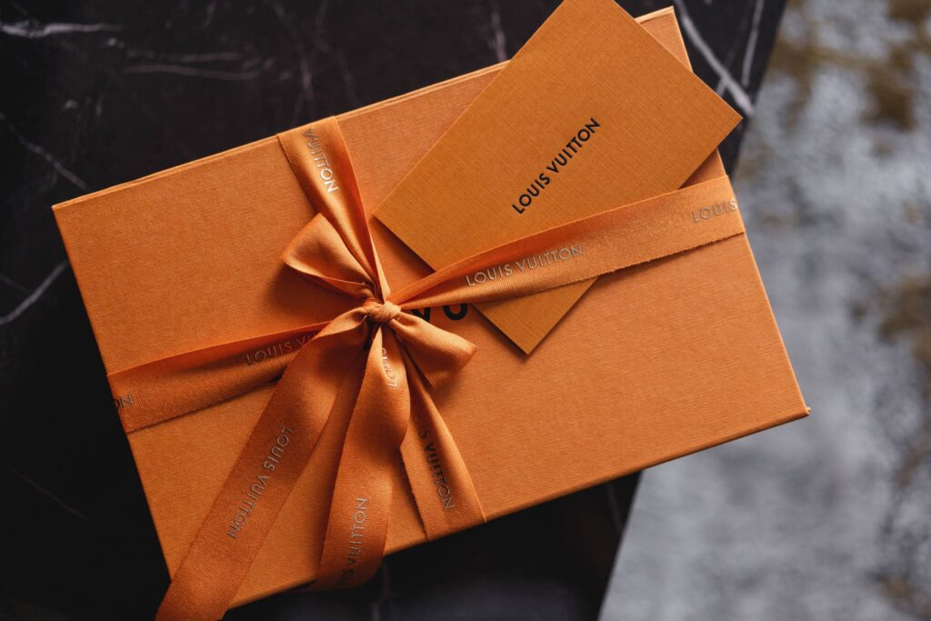 Classic Famous Louis Vuitton Orange Product Box Packaging with a Bow Free Photo