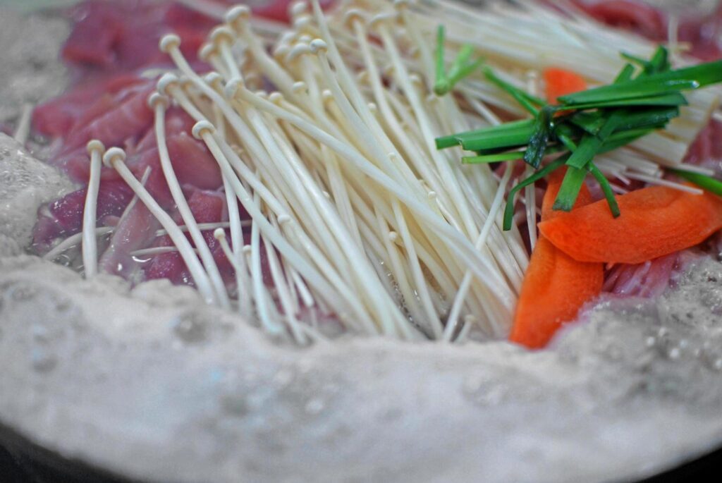 Close up of Asian traditional hot pot for part with friend or family meal. Poppular food in asian country. selective focus background Stock Free