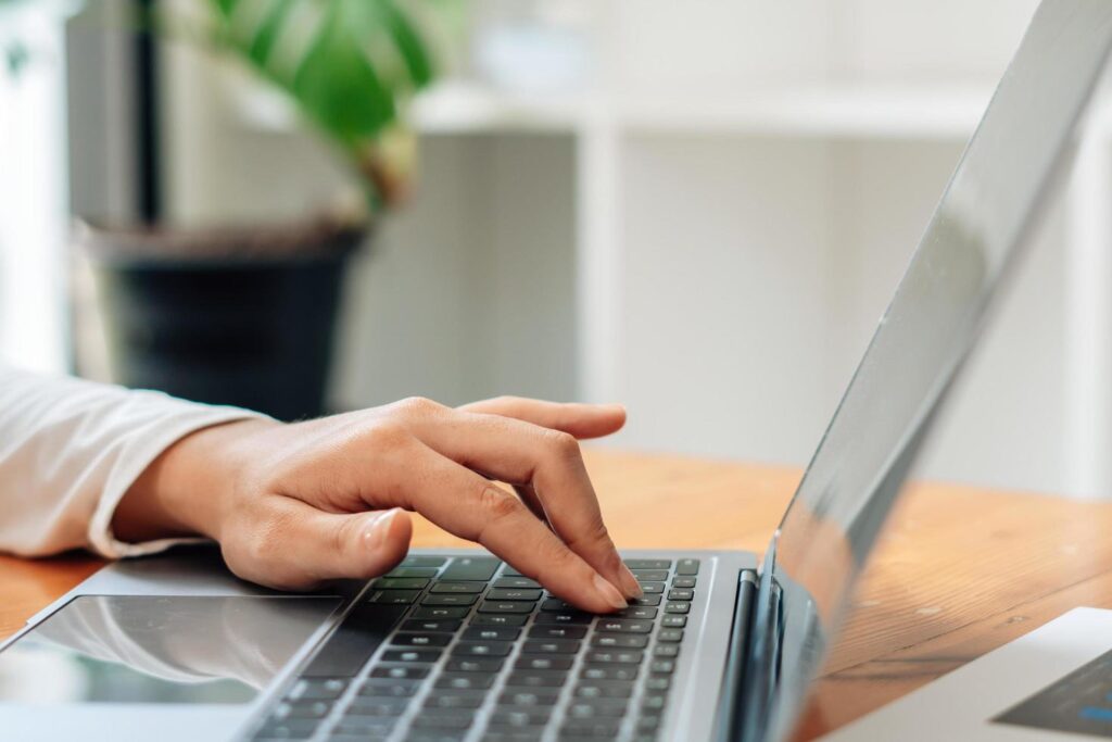 Close up of businessman or accountant working on laptop computer for calculate business data, accounting document and calculator at office, business concept Stock Free