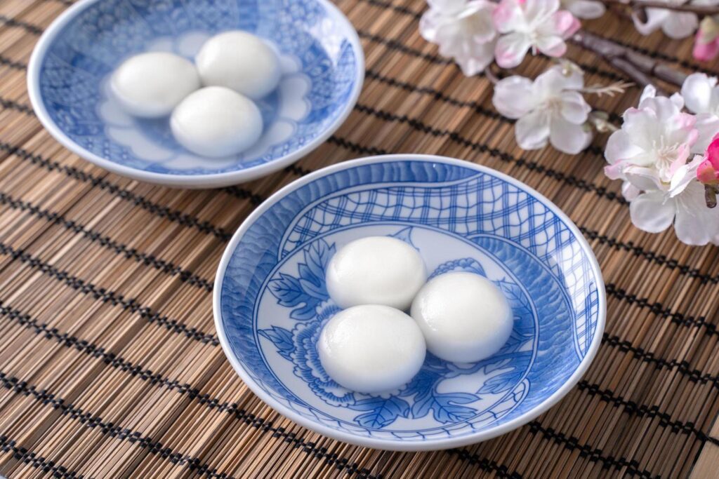 Close up of tangyuan yuanxiao in a bowl on gray table, food for Winter Solstice. Stock Free