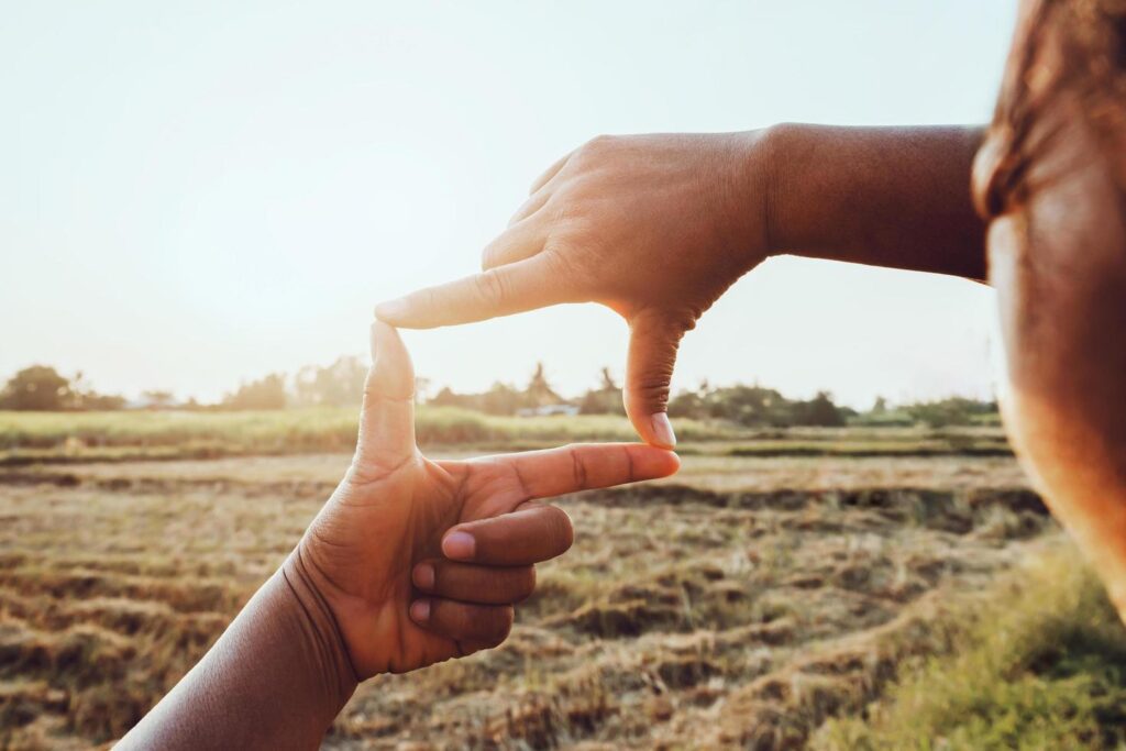 close up woman make hand framing gesture distant view. business concept Stock Free