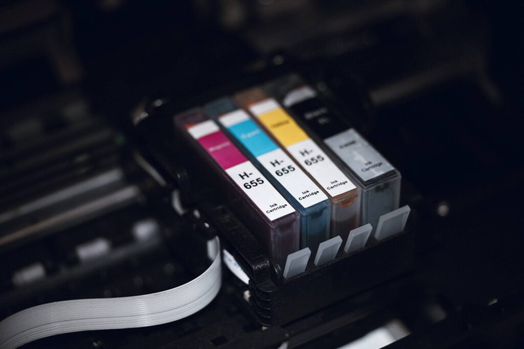 CMYK Printing Cartridges in Printer Free Photo