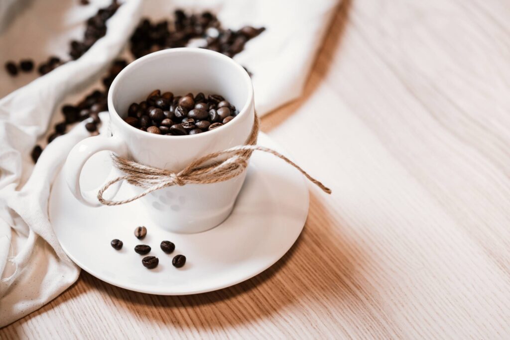 Coffee Beans in a Mug Free Photo