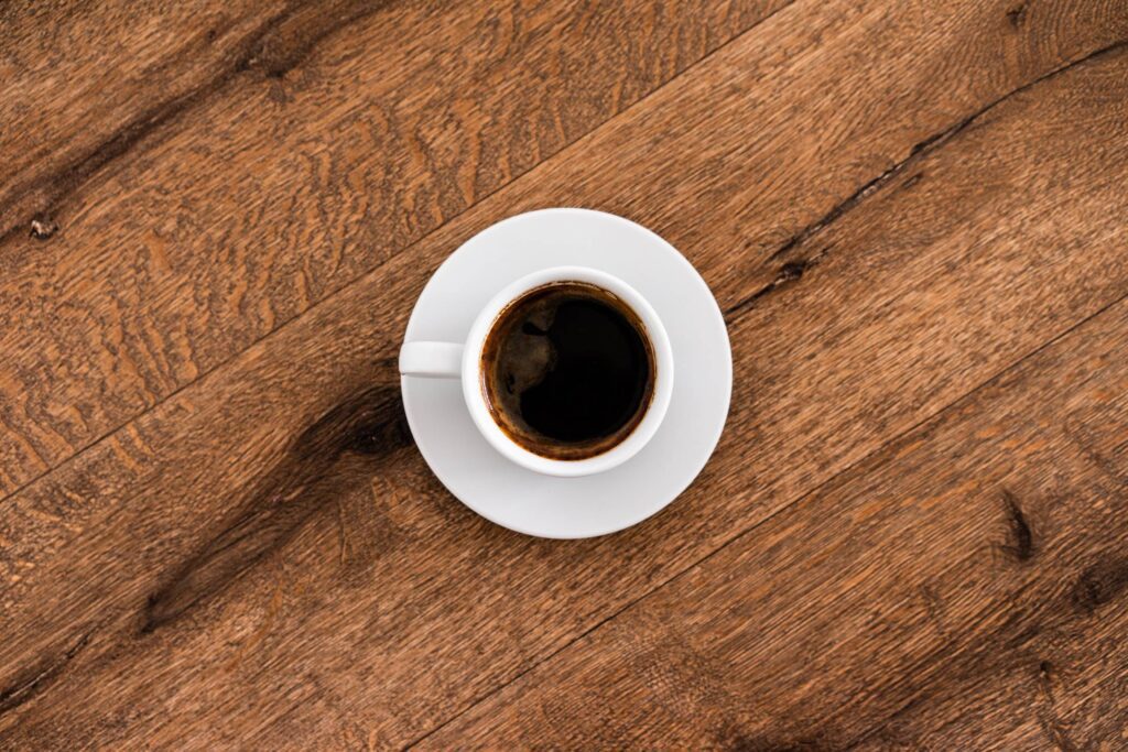 Coffee Cup on a Wooden Table Free Photo