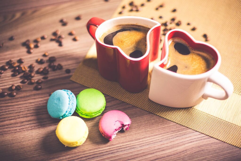 Coffee in Heart Cups and Sweet Yummy Macarons Free Photo