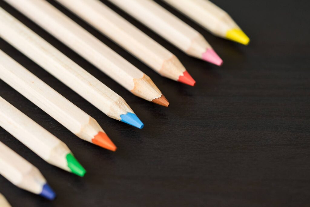 Colored Pencils in a Row with Room for Text Free Photo