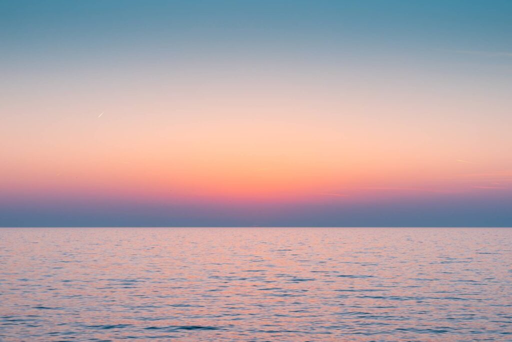 Colorful Dawn Sky Above The Calm Sea Horizon Free Photo