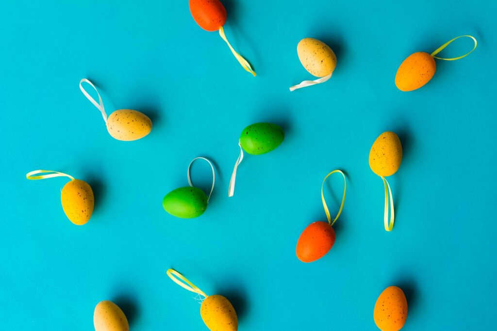 Colorful Easter Eggs on Blue Background Free Photo