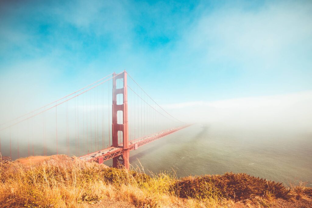 Colorful Golden Gate Bridge in Foggy But Sunny Weather Free Photo