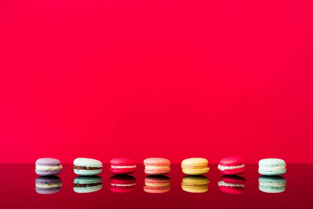 Colorful Macarons on a Glass Table Free Photo