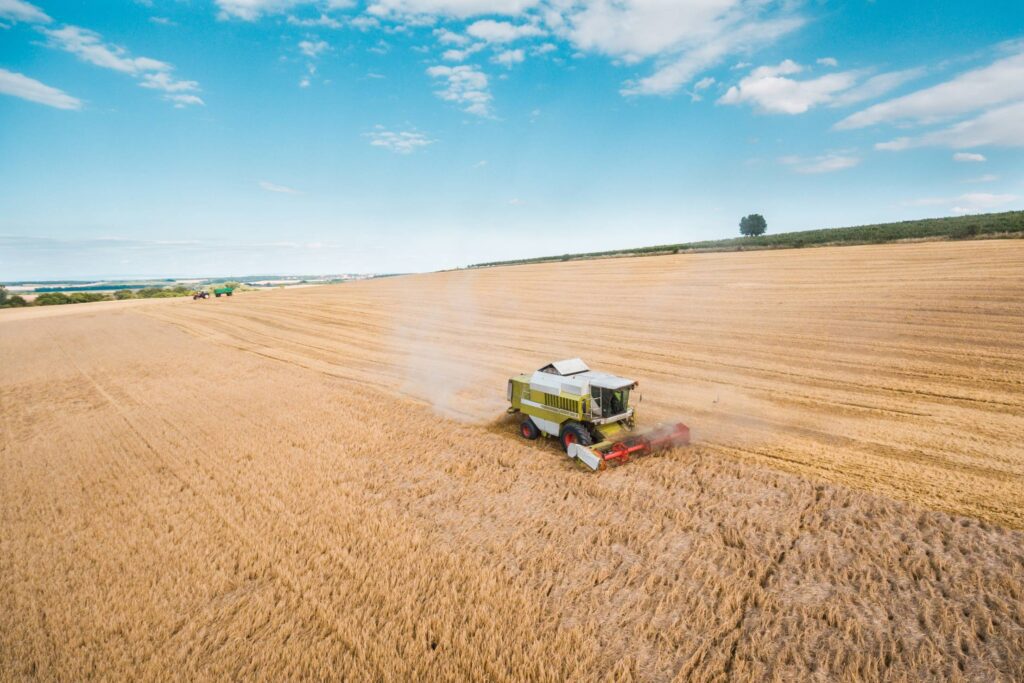 Combine Harvester Harvesting Wheat Crops Free Photo