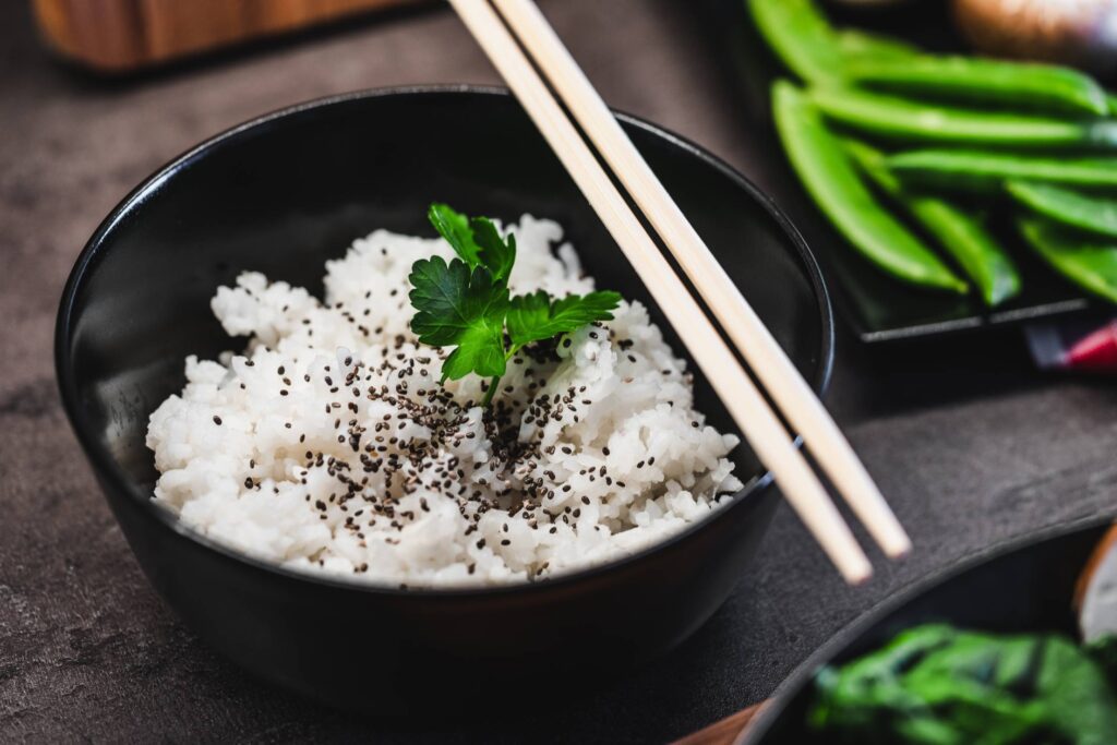 Cooked Jasmine Rice with Black Sesame and Chopsticks Free Photo