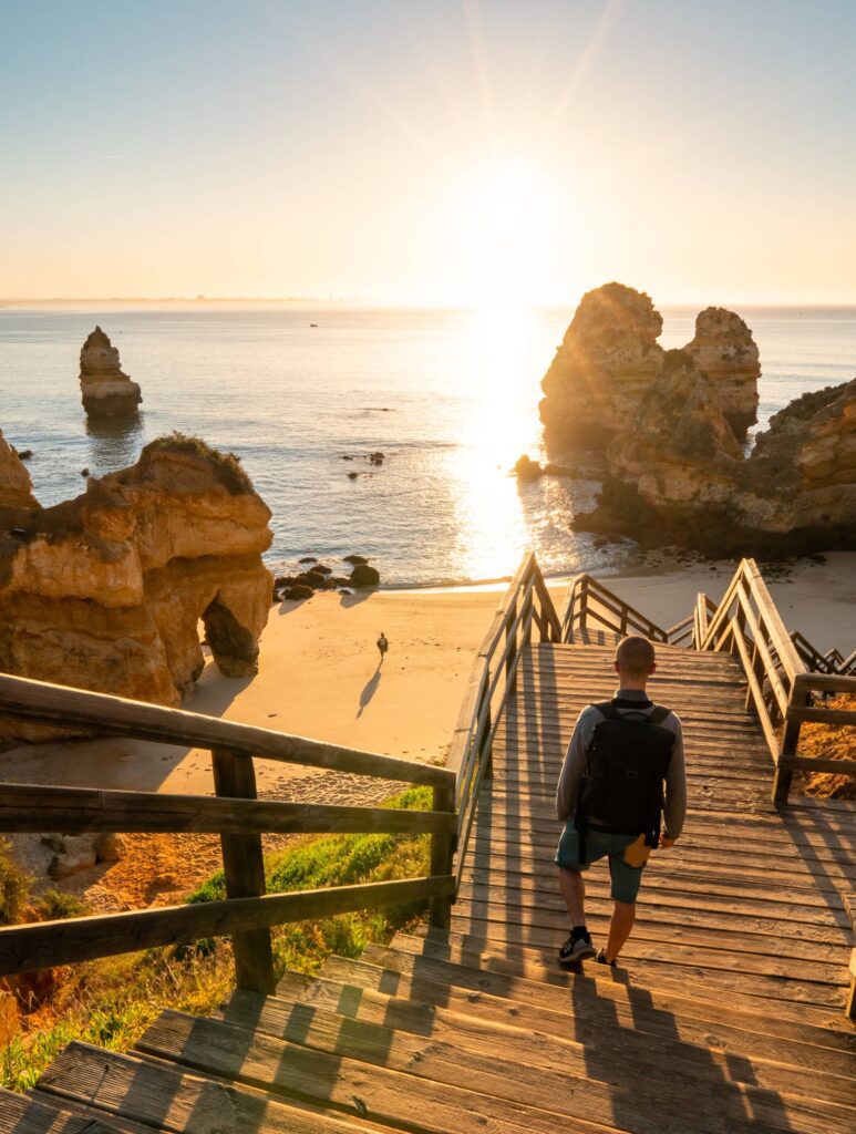 Couple on a Beach Enjoying Sunrise Free Photo