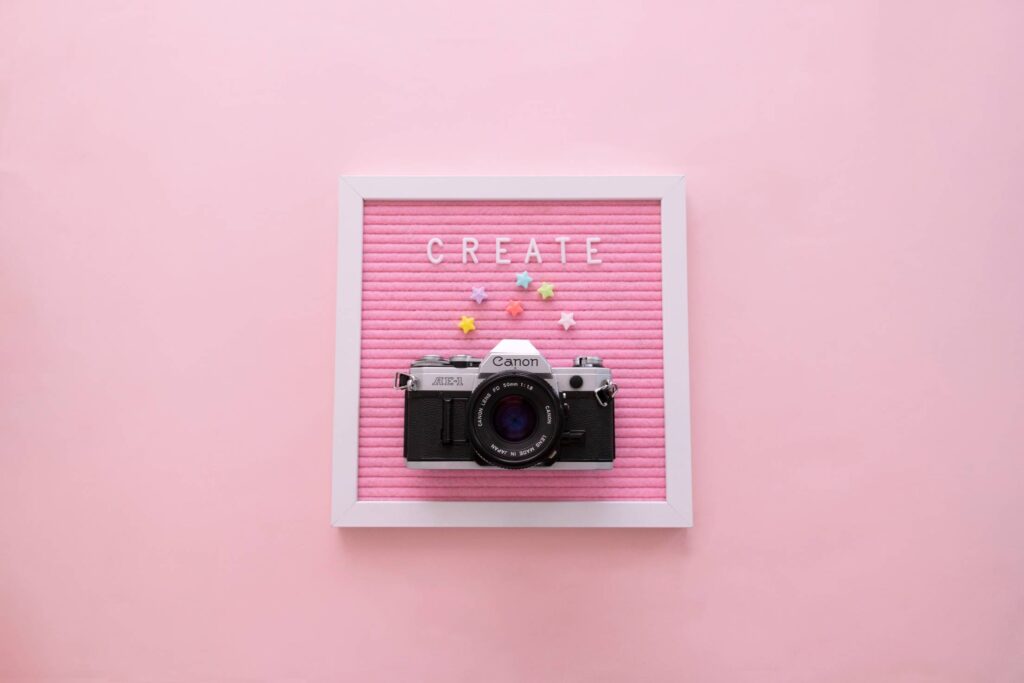 “Create” Word on Pink Letter Board with Camera Free Photo