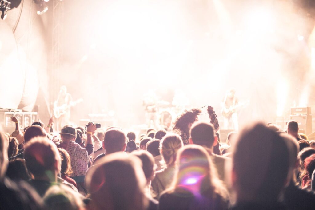 Crowds of Party People Enjoying a Live Concert Free Photo