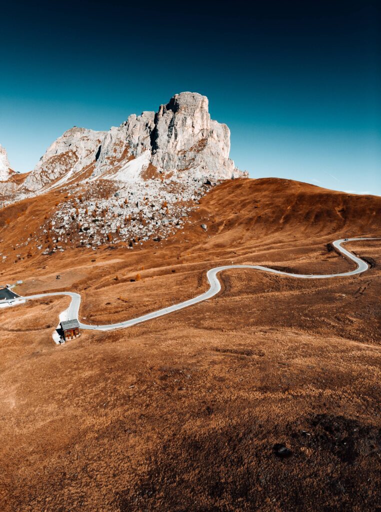 Curved Road of Giau Pass with the La Gusela Mountain in Italy Free Photo