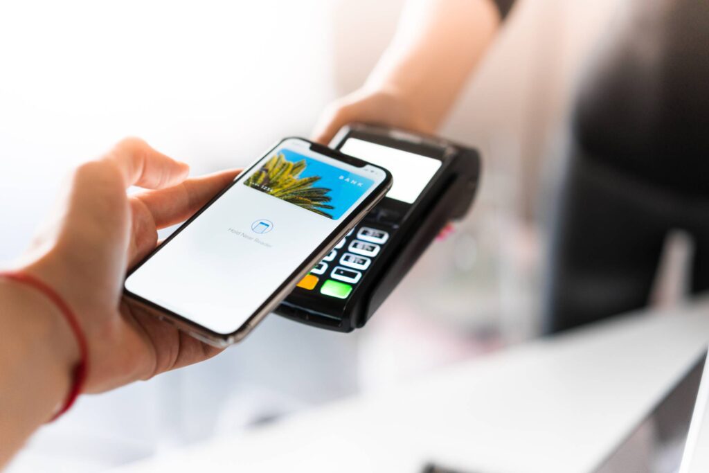 Customer Using Apple Pay for NFC Payment Free Photo