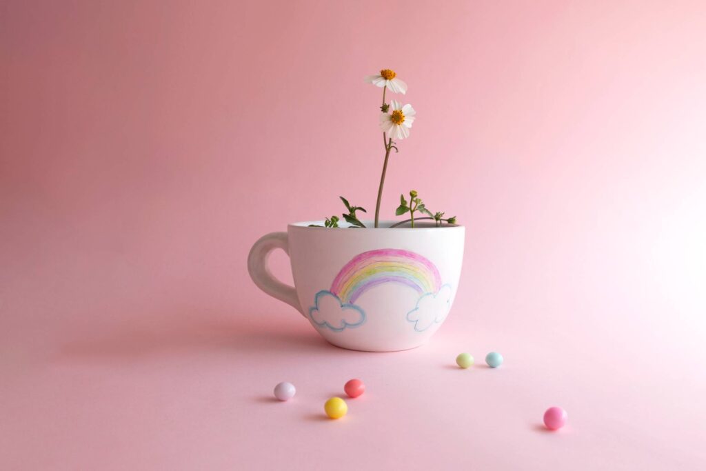 Cute Rainbow Cup with Flower Inside Free Photo