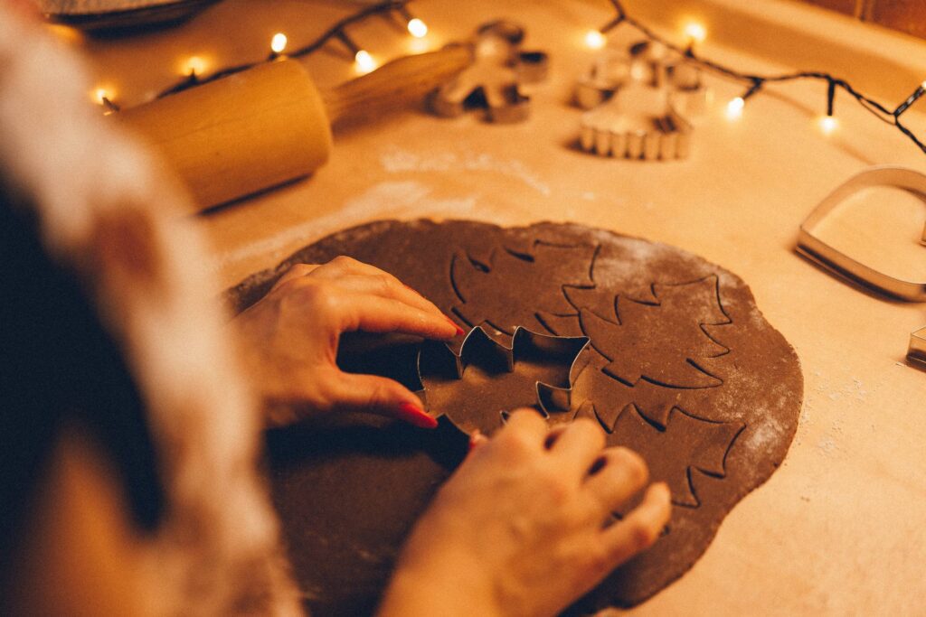 Cutting Christmas Gingerbread Dough Free Photo