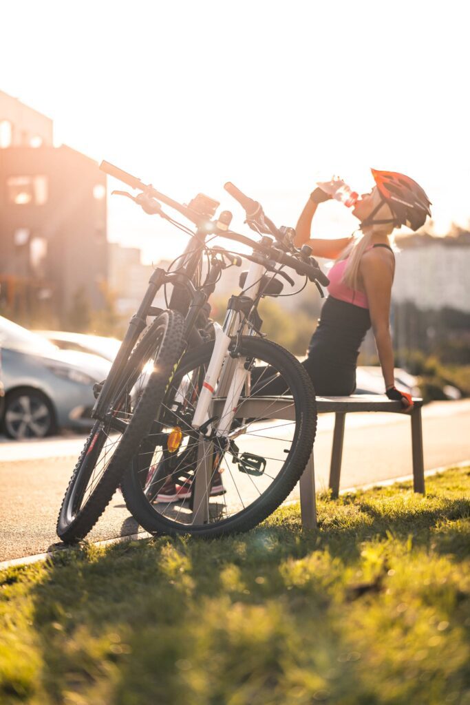 Cyclist Drinking from a Bottle Free Photo