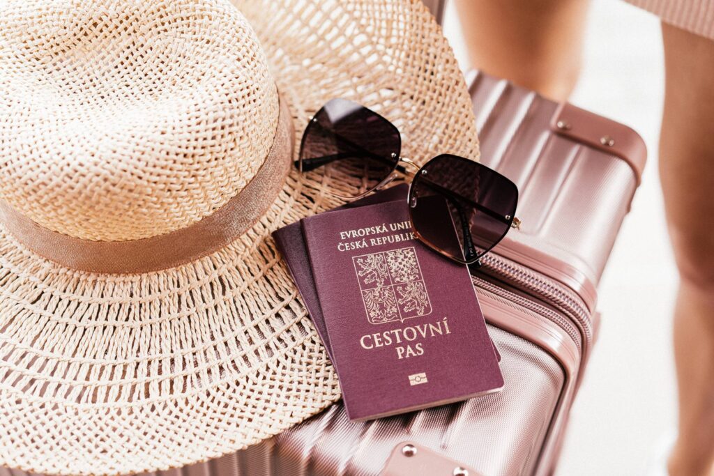 Czech Passport with Sunglasses and Hat on a Suitcase Free Photo