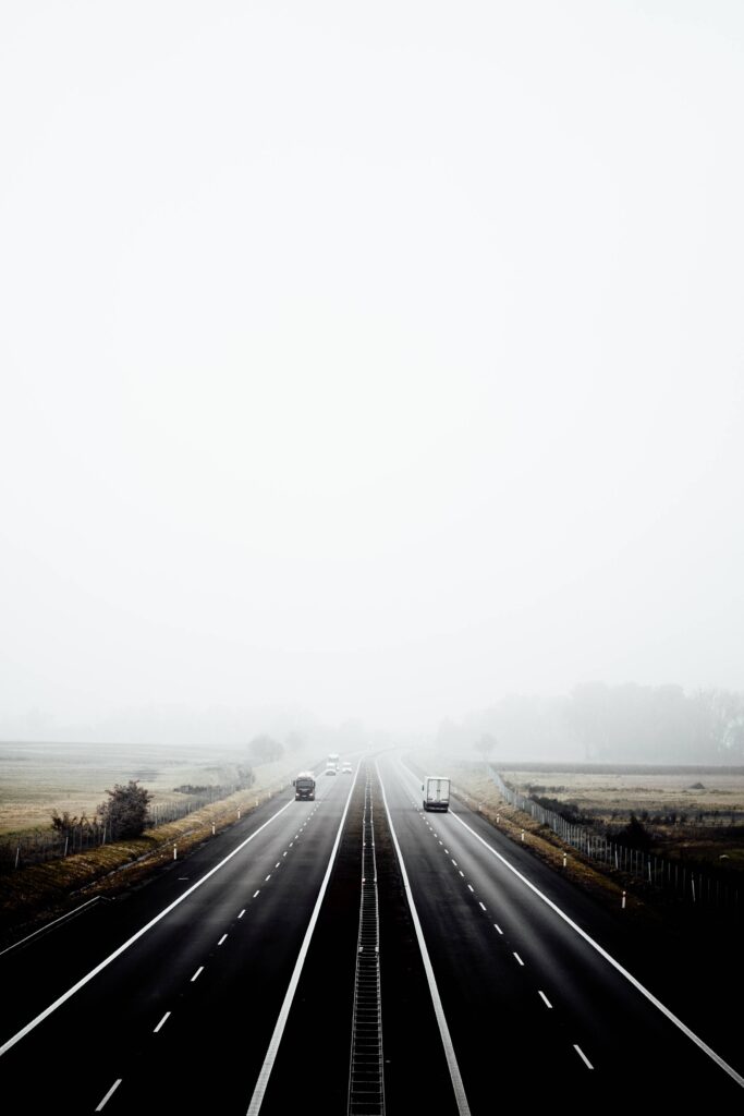 Dark Highway in Foggy Weather Place for Text Free Photo