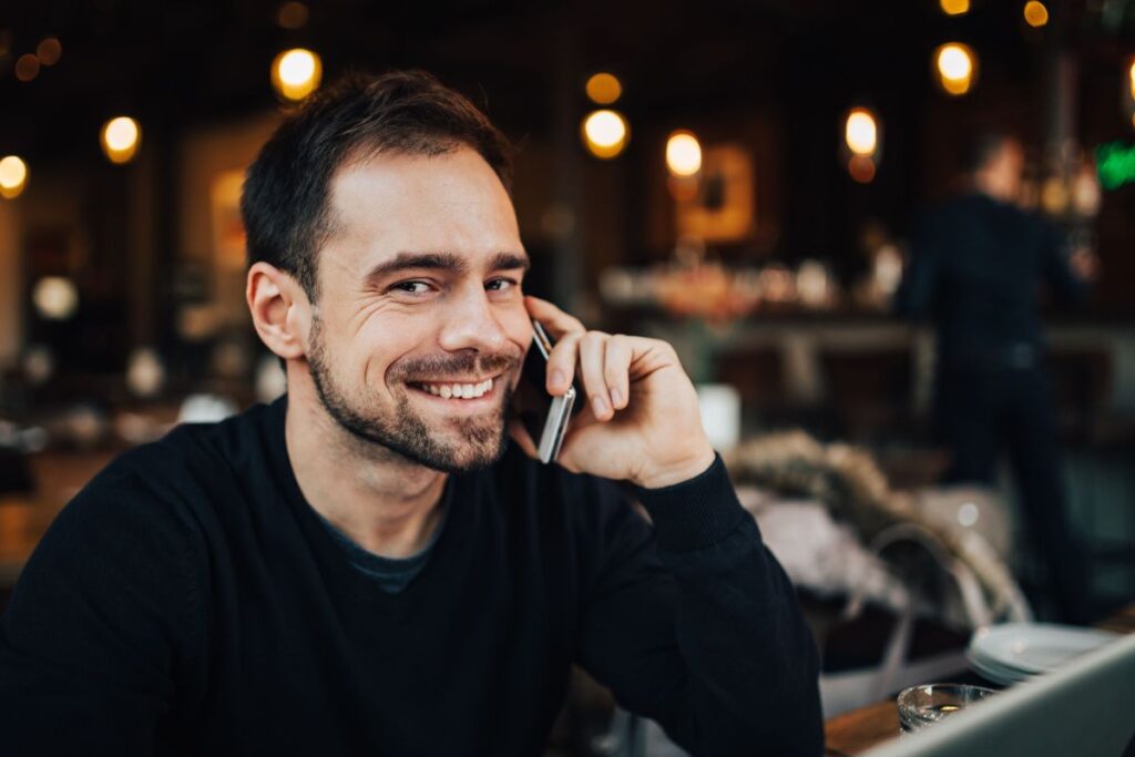 Young Entrepreneur Working from a Modern Cafe Stock Free