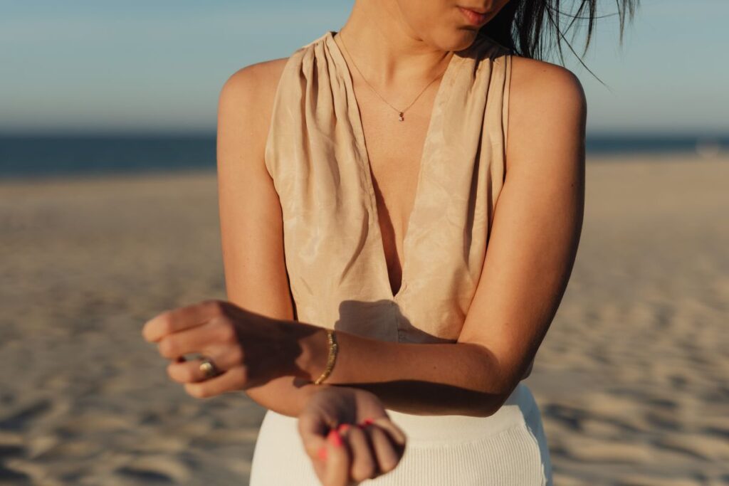 Young stylish woman poses on the beach at sunset Stock Free