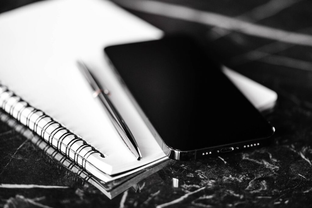 Diary, Pen and Smartphone on Table Free Photo