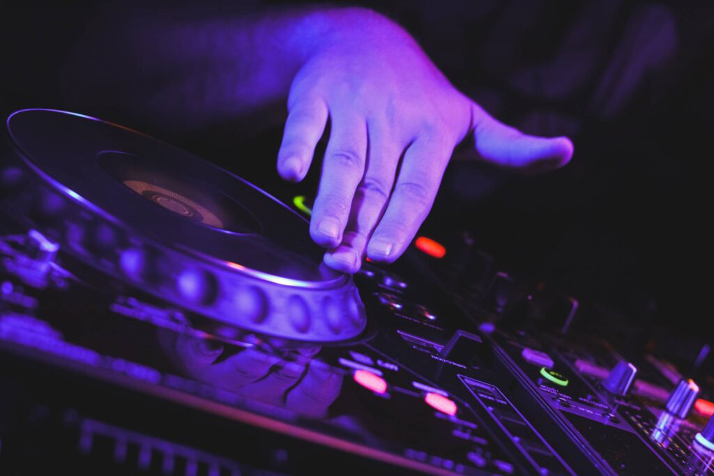 DJ’s Scratching on CD Players Hand Close Up Free Photo