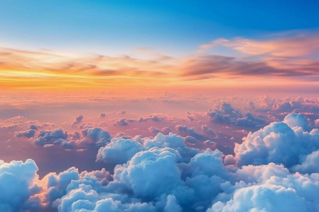 dramatic white clouds and blue sky from airplane Stock Free