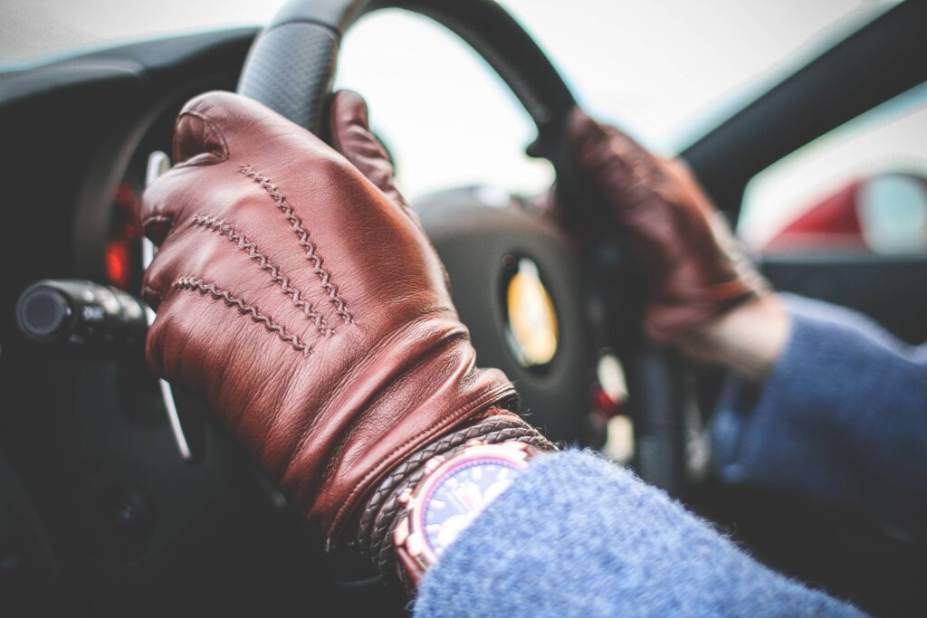 Driver with Brown Leather Driving Gloves Free Photo