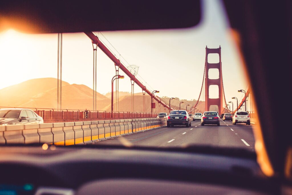 Driving Over The Golden Gate Bridge in Sunset Free Photo