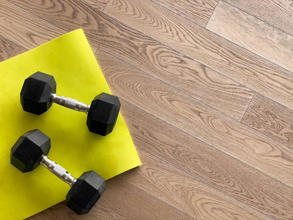 Dumbbells and Exercise Mat Free Photo