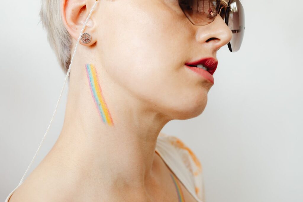 Girls paint an LGBT rainbow on their bodies Stock Free