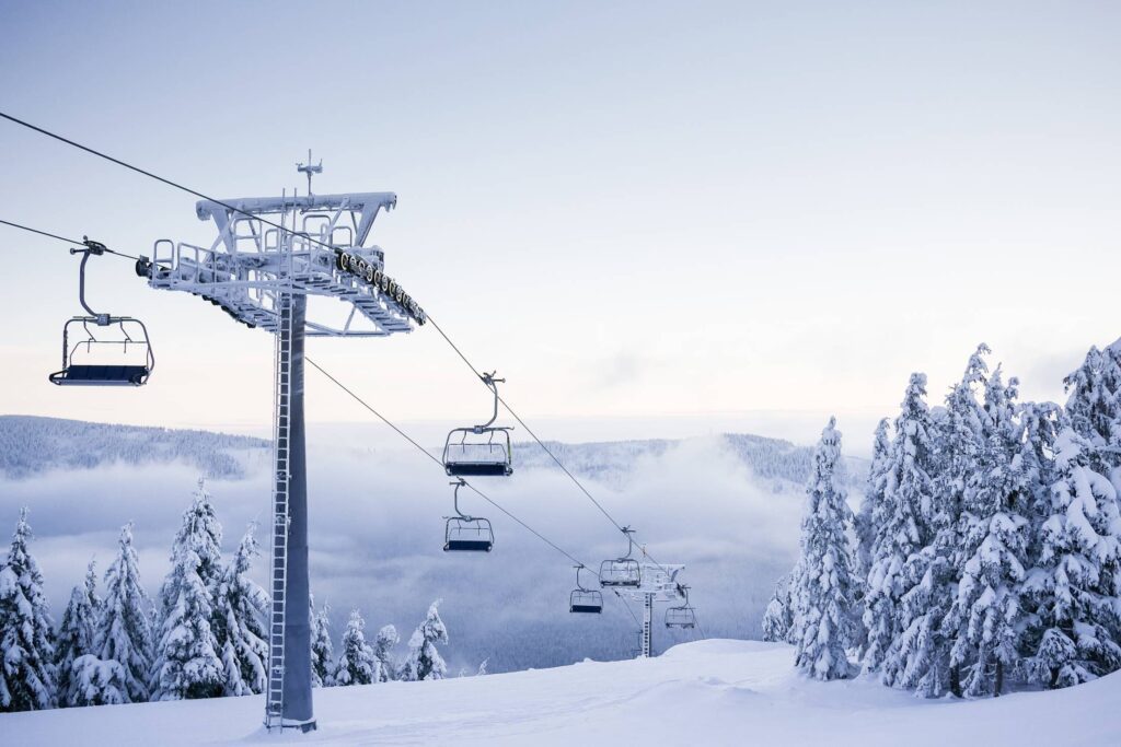 Empty Chair Ski Lift on Bright Winter Day Free Photo