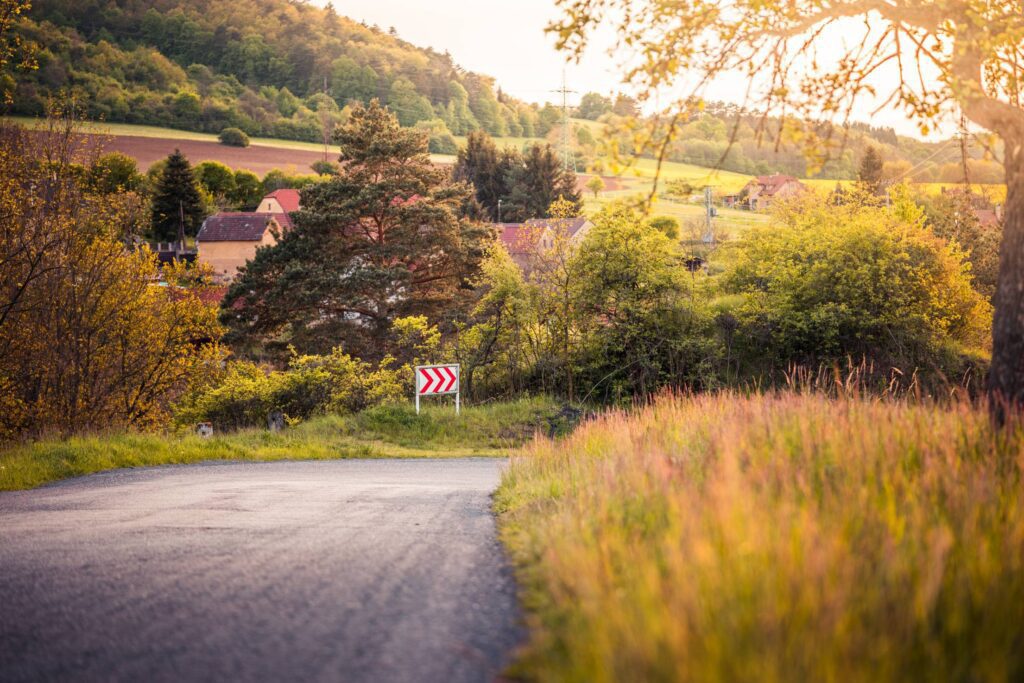 Empty Road with Turning Right Sign Free Photo