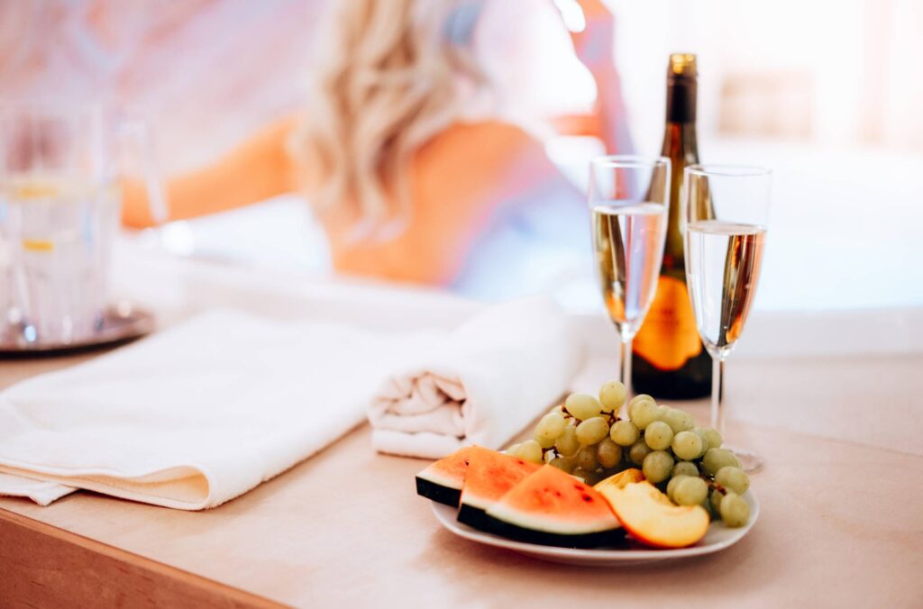 Enjoying Prosecco and Fresh Fruits in a Whirlpool Free Photo