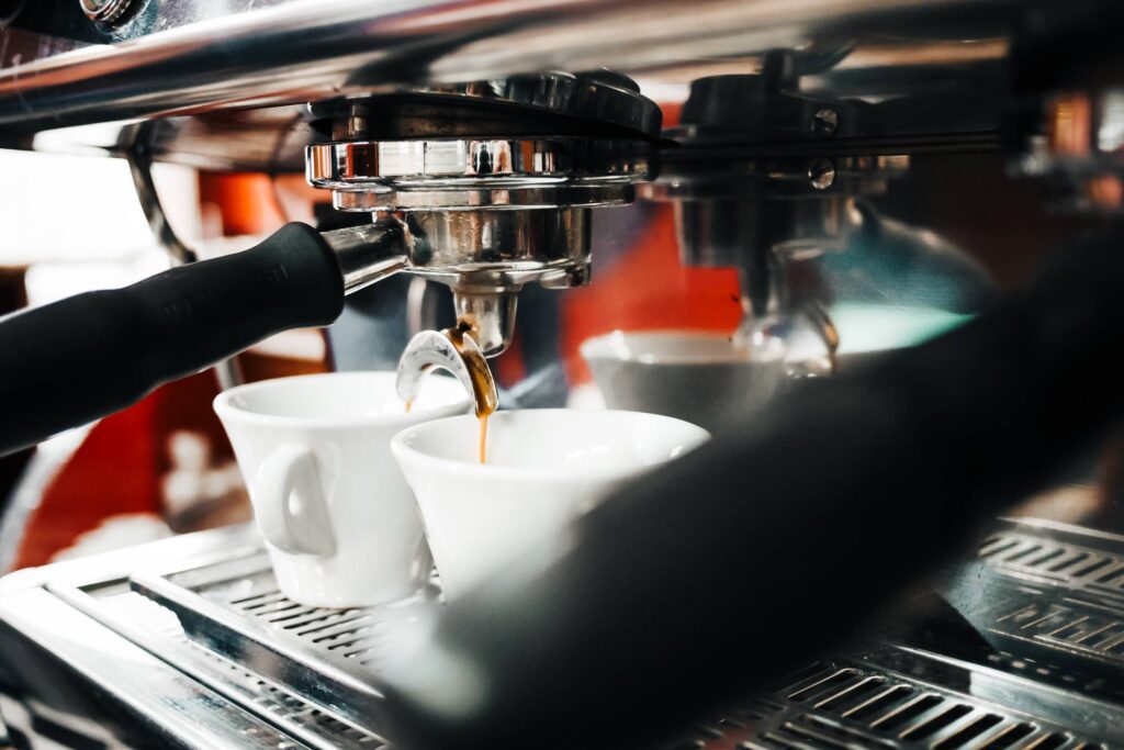 Espresso Machine Making Coffee in Bar Free Photo