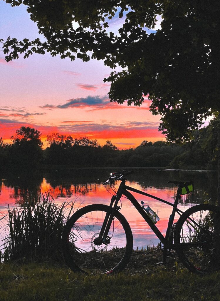 Evening MTB Ride Mountain Bike with Sunset Golden Sky Free Photo