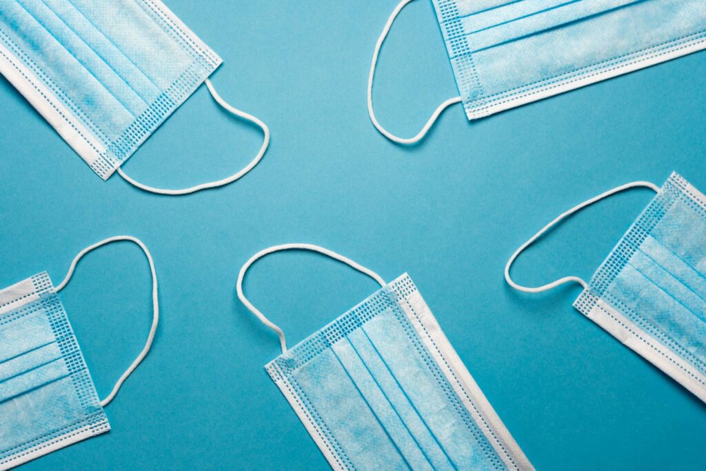 Face Masks on a Blue Background Free Photo