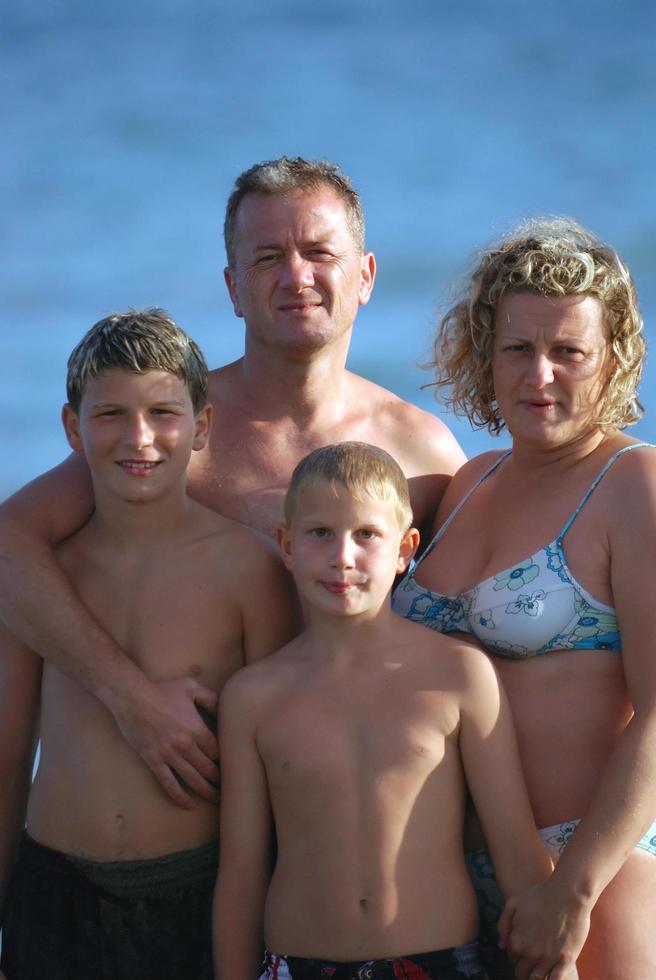 family portrait on beach at summer holidays Stock Free